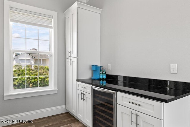 3083 S Ponte Vedra Blvd, Ponte Vedra Beach, FL 32082 - indoor dry bar with wine cooler, healthy amount of natural light, baseboards, and dark wood finished floors