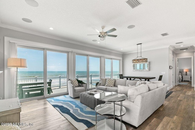 3083 S Ponte Vedra Blvd, Ponte Vedra Beach, FL 32082 - living area with ceiling fan, crown molding, a textured ceiling, wood finished floors, and recessed lighting