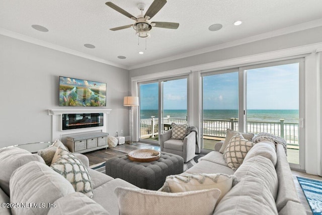 3083 S Ponte Vedra Blvd, Ponte Vedra Beach, FL 32082 - living area featuring wood finished floors, a ceiling fan, healthy amount of natural light, ornamental molding, and recessed lighting