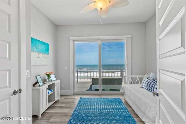 3083 S Ponte Vedra Blvd, Ponte Vedra Beach, FL 32082 - sitting room featuring light wood finished floors, ceiling fan, a water view, and baseboards