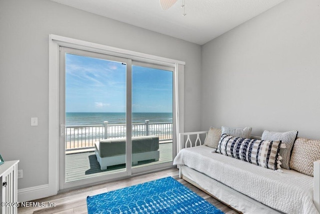 3083 S Ponte Vedra Blvd, Ponte Vedra Beach, FL 32082 - living area with healthy amount of natural light, wood finished floors, a water view, and baseboards