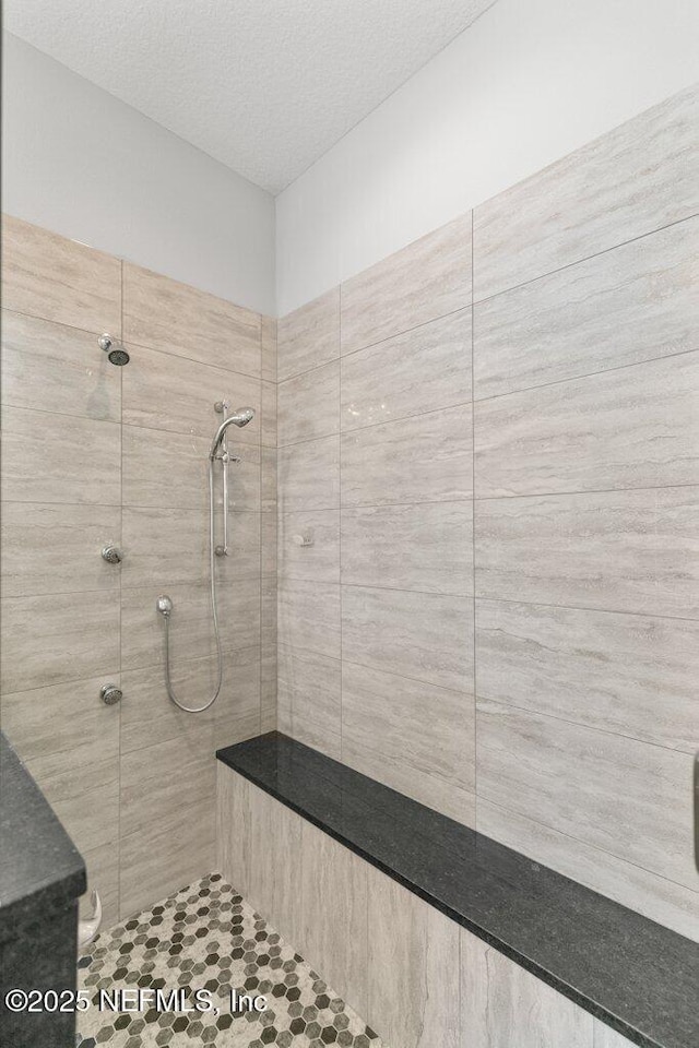 3083 S Ponte Vedra Blvd, Ponte Vedra Beach, FL 32082 - full bath with a tile shower and a textured ceiling