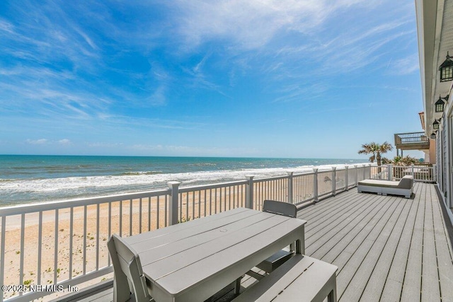 3083 S Ponte Vedra Blvd, Ponte Vedra Beach, FL 32082 - wooden terrace featuring view of water and beach and outdoor dining space