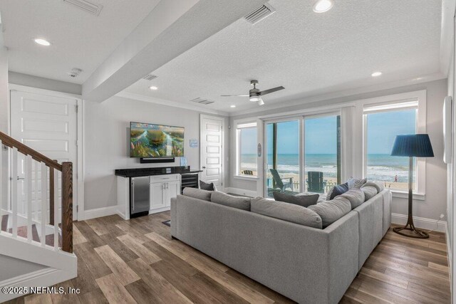 3083 S Ponte Vedra Blvd, Ponte Vedra Beach, FL 32082 - living area with stairway, baseboards, ceiling fan, wood finished floors, and a textured ceiling