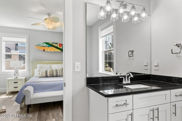 3083 S Ponte Vedra Blvd, Ponte Vedra Beach, FL 32082 - bathroom featuring wood finished floors, vanity, connected bathroom, a ceiling fan, and baseboards
