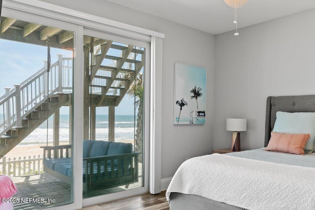 3083 S Ponte Vedra Blvd, Ponte Vedra Beach, FL 32082 - bedroom with access to exterior, wood finished floors, and view of water and beach