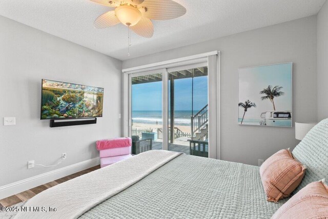 3083 S Ponte Vedra Blvd, Ponte Vedra Beach, FL 32082 - bedroom with access to exterior, wood finished floors, baseboards, and a ceiling fan
