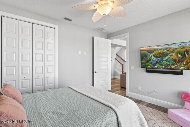 3083 S Ponte Vedra Blvd, Ponte Vedra Beach, FL 32082 - bedroom featuring wood finished floors, a closet, ceiling fan, baseboards, and a textured ceiling