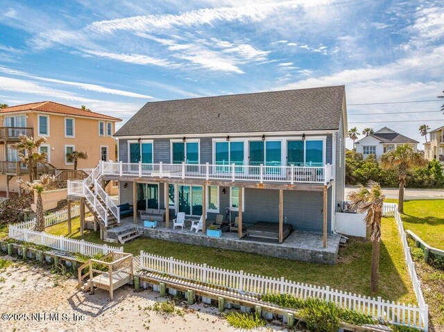 3083 S Ponte Vedra Blvd, Ponte Vedra Beach, FL 32082 - rear view of property with a patio, a wooden deck, a shingled roof, and stairway
