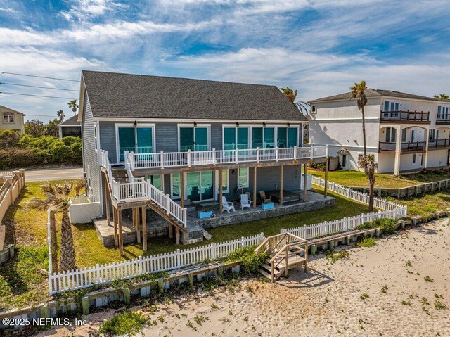 3083 S Ponte Vedra Blvd, Ponte Vedra Beach, FL 32082 - rear view of house featuring stairs, a patio, a wooden deck, and roof with shingles