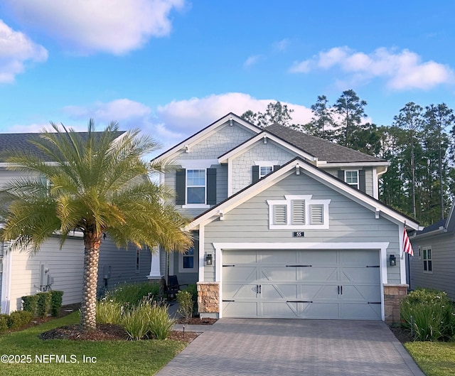55 Rainbow Trout Ln, Ponte Vedra, FL 32081 - craftsman house with driveway, stone siding, and an attached garage