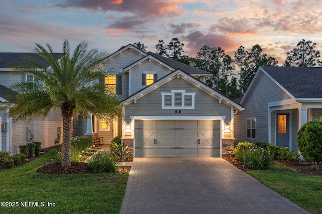 55 Rainbow Trout Ln, Ponte Vedra, FL 32081 - craftsman house with decorative driveway, an attached garage, and a front lawn