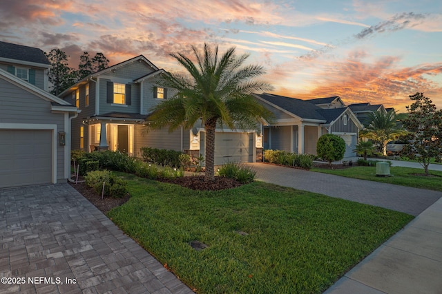 55 Rainbow Trout Ln, Ponte Vedra, FL 32081 - view of front of house with decorative driveway, an attached garage, and a front lawn
