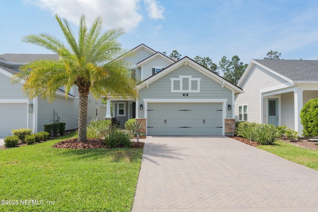 55 Rainbow Trout Ln, Ponte Vedra, FL 32081 - traditional home featuring an attached garage, a front yard, and decorative driveway