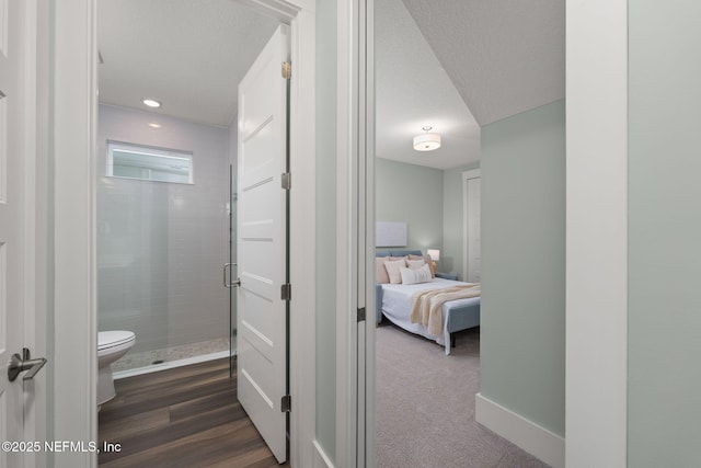 55 Rainbow Trout Ln, Ponte Vedra, FL 32081 - full bathroom featuring a shower stall, toilet, a textured ceiling, baseboards, and ensuite bath