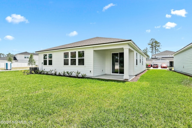 2442 Glade Ln, Green Cove Springs, FL 32043 - rear view of property with a lawn, a patio area, central AC unit, and roof with shingles