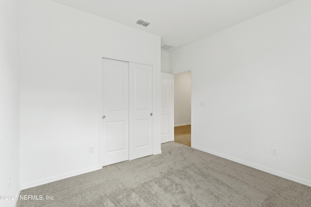 2442 Glade Ln, Green Cove Springs, FL 32043 - unfurnished bedroom with carpet flooring, a closet, and baseboards