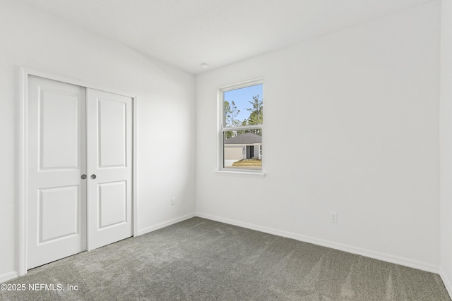 2442 Glade Ln, Green Cove Springs, FL 32043 - unfurnished bedroom with carpet floors, baseboards, and a closet