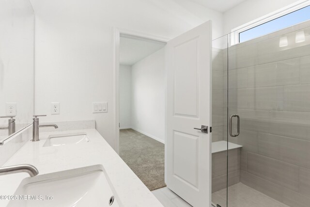 2442 Glade Ln, Green Cove Springs, FL 32043 - bathroom featuring double vanity and a shower stall