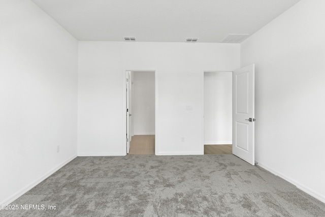 2442 Glade Ln, Green Cove Springs, FL 32043 - unfurnished bedroom featuring carpet flooring, baseboards, and a walk in closet