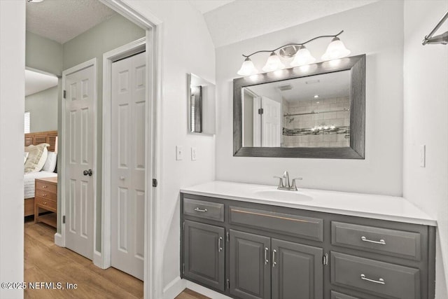7372 Secret Woods Dr, Jacksonville, FL 32216 - full bath with wood finished floors, vanity, and tiled shower