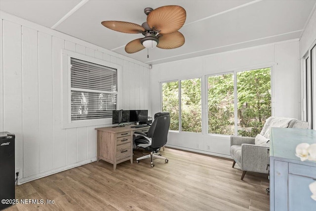 7372 Secret Woods Dr, Jacksonville, FL 32216 - home office with plenty of natural light, light wood-type flooring, and a ceiling fan