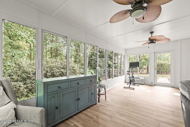 7372 Secret Woods Dr, Jacksonville, FL 32216 - sunroom / solarium with ceiling fan, a decorative wall, and wood finished floors