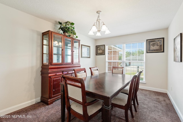 dining room featuring an inviting chandelier, baseboards, and dark colored carpet