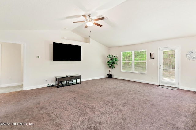 unfurnished living room featuring baseboards, carpet, ceiling fan, and vaulted ceiling