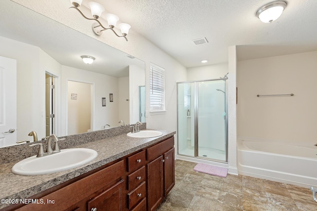 full bathroom with double vanity, visible vents, a sink, and a stall shower