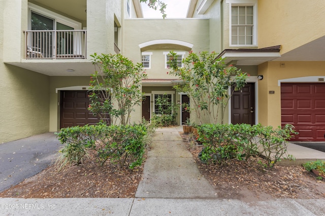 2005 Mariposa Vista Ln Unit 3-123, Saint Augustine, FL 32084 - entrance to property featuring a garage and stucco siding
