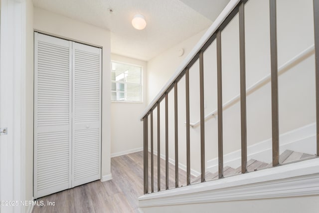 2005 Mariposa Vista Ln Unit 3-123, Saint Augustine, FL 32084 - stairs with baseboards and wood finished floors