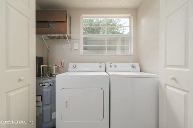 2005 Mariposa Vista Ln Unit 3-123, Saint Augustine, FL 32084 - laundry room with laundry area, washing machine and clothes dryer, and electric water heater