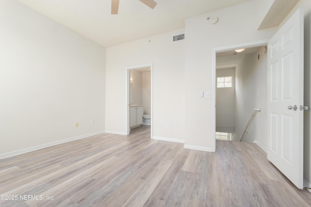 2005 Mariposa Vista Ln Unit 3-123, Saint Augustine, FL 32084 - unfurnished bedroom with ceiling fan, visible vents, light wood-type flooring, baseboards, and ensuite bath