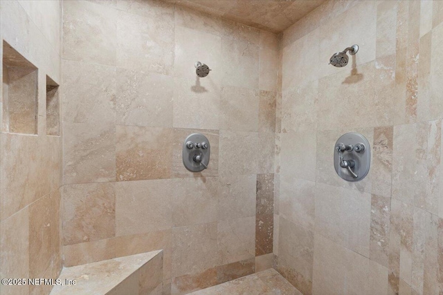 bathroom with a tile shower