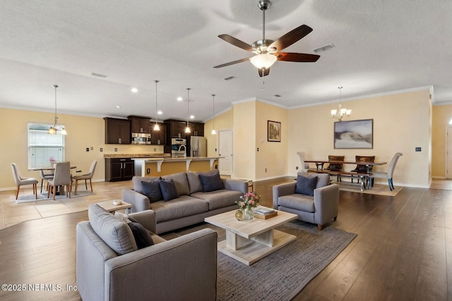 living room featuring crown molding and baseboards