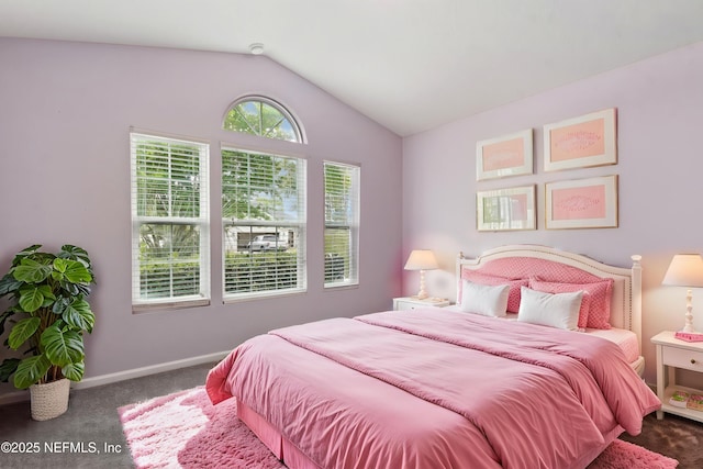 bedroom featuring carpet floors, baseboards, and vaulted ceiling