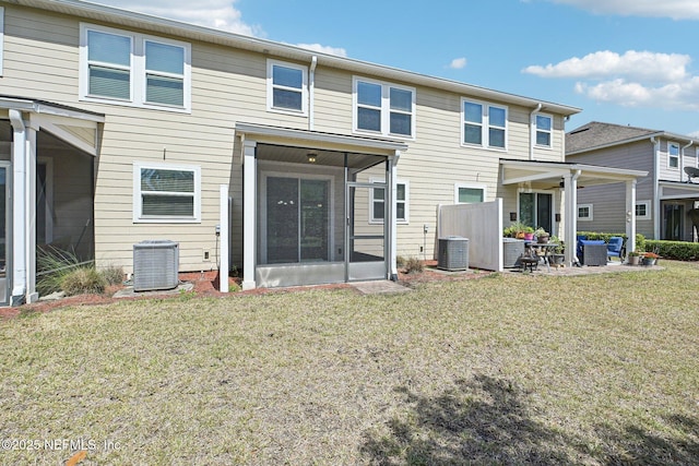 53 Nelson Ln, Saint Johns, FL 32259 - back of house featuring a lawn, central air condition unit, and a sunroom