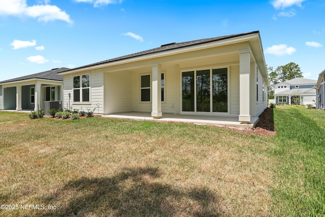 2413 Glade Ln, Green Cove Springs, FL 32043 - rear view of property with a patio area and a yard