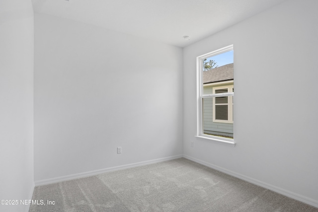 2413 Glade Ln, Green Cove Springs, FL 32043 - spare room featuring carpet floors and baseboards