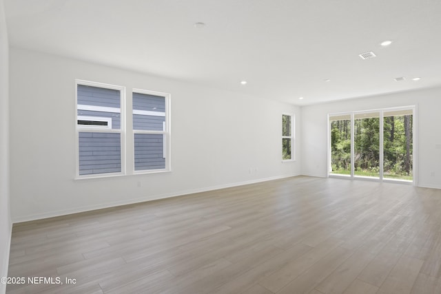 2413 Glade Ln, Green Cove Springs, FL 32043 - empty room with baseboards, light wood-style flooring, and recessed lighting