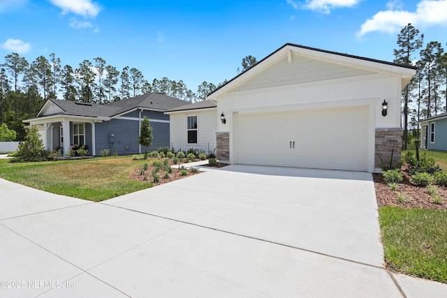 2413 Glade Ln, Green Cove Springs, FL 32043 - view of front facade with stone siding, driveway, an attached garage, and a front yard