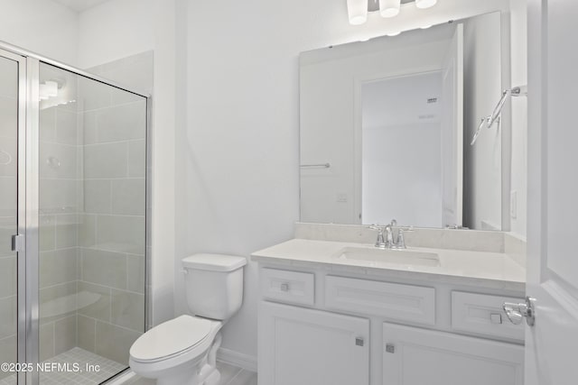 2413 Glade Ln, Green Cove Springs, FL 32043 - bathroom with vanity, toilet, a stall shower, and baseboards