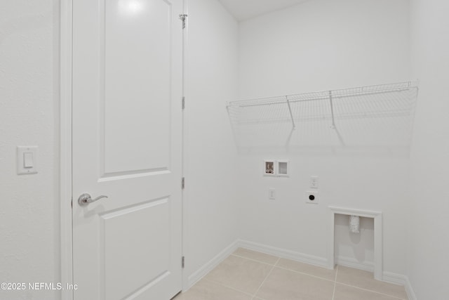 2413 Glade Ln, Green Cove Springs, FL 32043 - laundry area with electric dryer hookup, hookup for a washing machine, baseboards, and light tile patterned floors