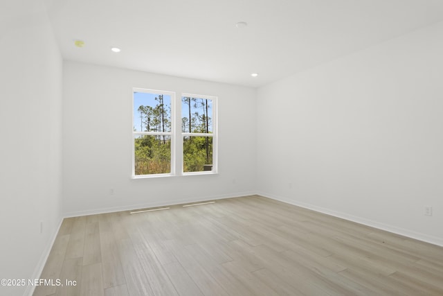 2413 Glade Ln, Green Cove Springs, FL 32043 - spare room with light wood finished floors, baseboards, and recessed lighting
