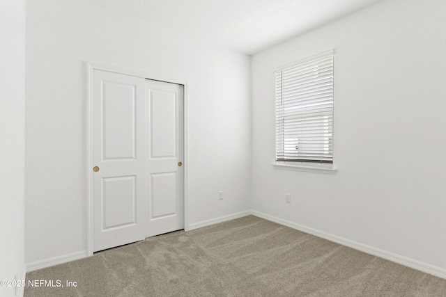 2416 Glade Ln, Green Cove Springs, FL 32043 - unfurnished bedroom featuring carpet floors and baseboards