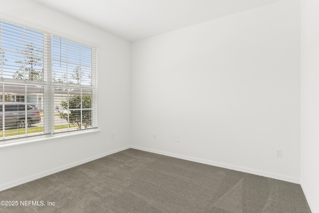 2416 Glade Ln, Green Cove Springs, FL 32043 - unfurnished room featuring dark carpet and baseboards