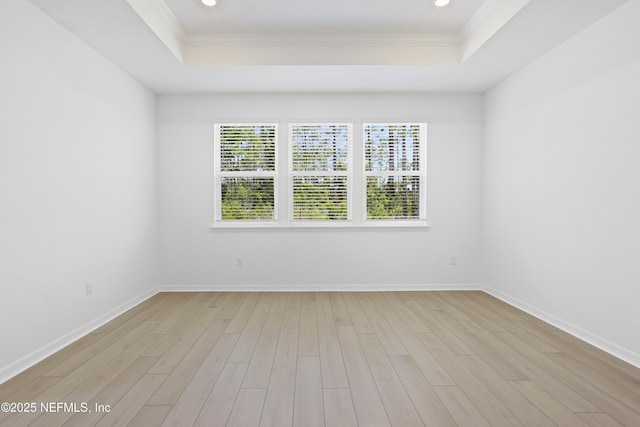 2416 Glade Ln, Green Cove Springs, FL 32043 - spare room with a raised ceiling, crown molding, light wood-style floors, baseboards, and recessed lighting