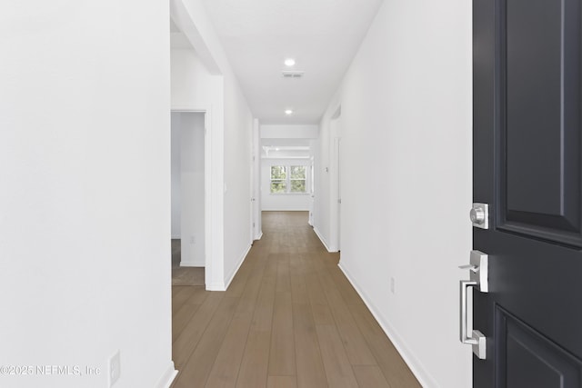 2416 Glade Ln, Green Cove Springs, FL 32043 - hallway featuring baseboards, recessed lighting, and wood finished floors