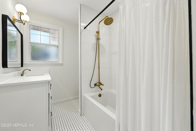 bathroom featuring vanity, baseboards, and shower / tub combo with curtain